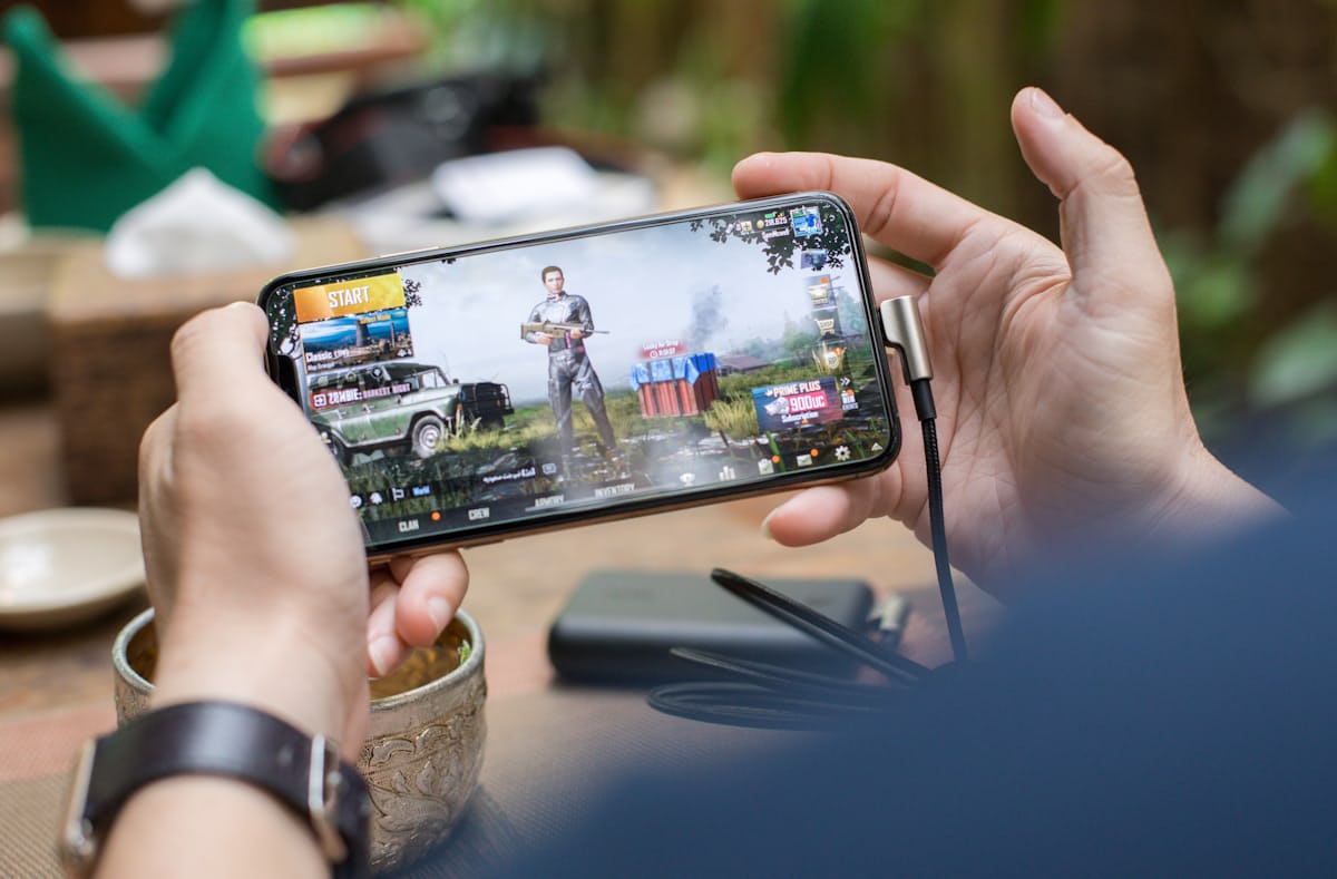 Mobile phone displaying colourful casual games