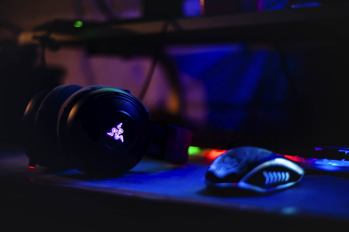 Gaming news desk with monitors and controllers